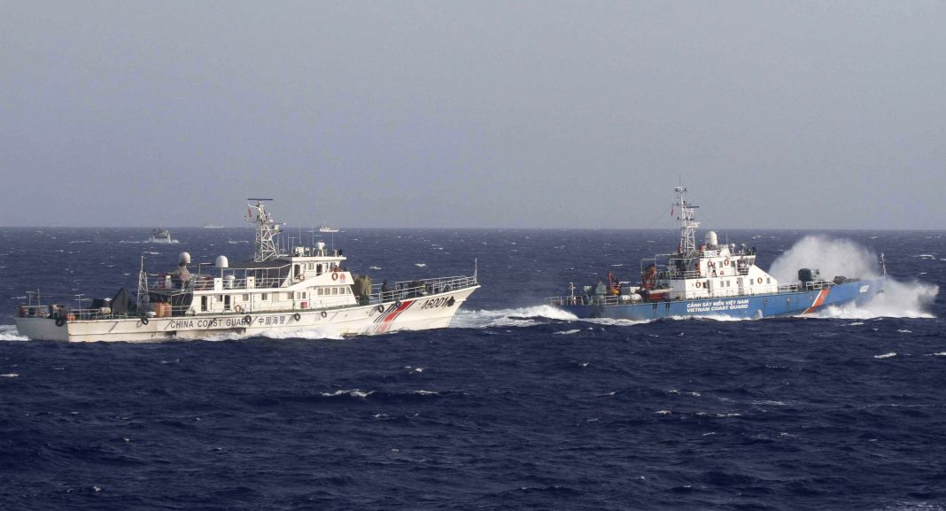 A-ship-right-of-Vietnam-Marine-Guard-seen-near-a-ship-of-the-Chinese-Coast-Guard-in-the-South-China