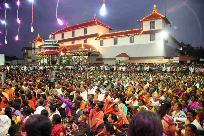 image shows the Dharmasthala Manjunatha Swamy Temple in the evening